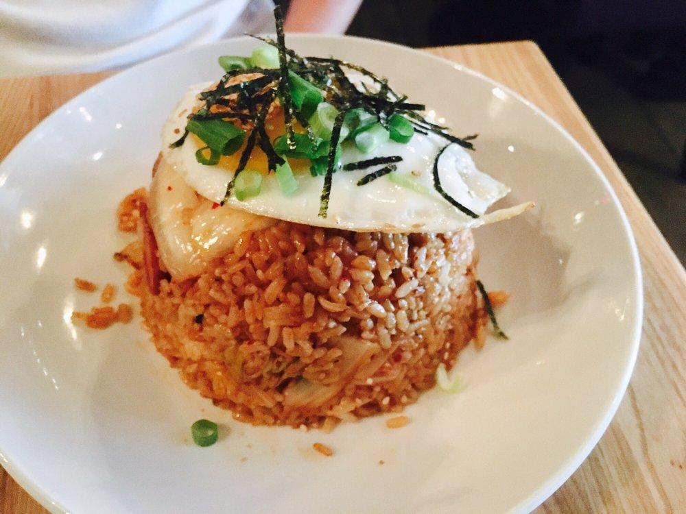 Kimchi Fried Rice · Fried rice wok fried with beef bulgogi, kimchi, sweet soy, topped with a fried egg, green onion and nori.