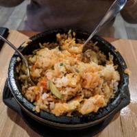 Hot Stone Bibimbap · Crispy rice, seasonal vegetables, white rice,  gochujang chili sauce, marinated beef bulgogi...