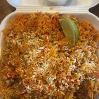 Lamb Biryani · Lamb, aromatic rice pilaf served with a side of curry sauce.