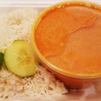 Butter Chicken · Boneless chicken cooked in butter with spices, cream and almonds.