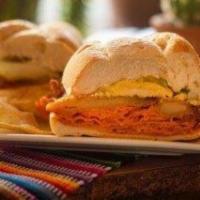 Tortas · Mexican sandwich made with refried beans, lettuce, tomato, avocado, mayo, jalapenos, quesill...