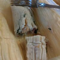 Tamales · Traditional Mexican dish, made of corn dough. Wrapped in corn husk.