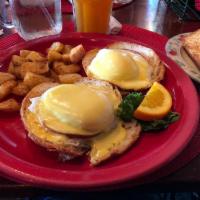 Eggs Benedict · 2 poached eggs and grilled canadian bacon on grilled croissants, finished with our fresh hol...