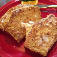 Cornbread French Toast · 3 slices of our cornbread are battered and grilled to a golden brown then topped with whippe...