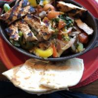Veggie Melt · Grilled pita bread topped with sauteed vegetables, herbs, tortellini, and a delicious blend ...