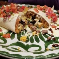 Burrito Gigante · Your choice of grilled steak, carnitas or chicken, wrapped in a large flour tortilla. Stuffe...