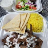 Gyro Plate · Most popular. Sliced gyro meat (a mixture of lamb and beef) rice, salad, pita bread, hummus ...