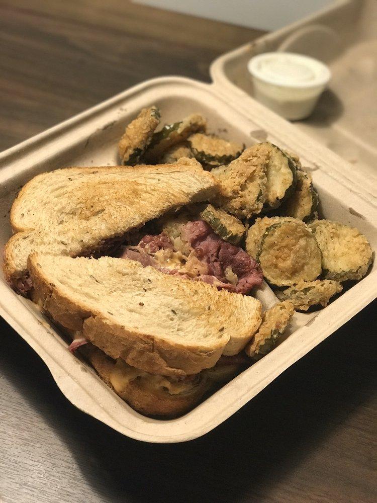 Press Box Reuben · Thinly sliced hot pastrami, Swiss cheese and sauerkraut with thousand island dressing on grilled rye. Served with fries.