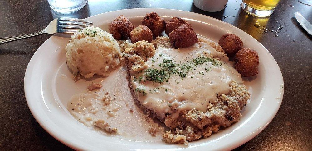 Country Fried Steak · The Classic done right! Topped with homemade country gravy and served with mashed potatoes and veggie medley.