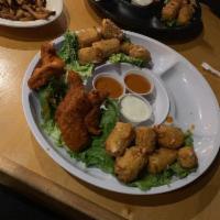 Buffalo Tenders · Chicken tenders hand-battered and covered in your choice of sauce, served with dill ranch an...