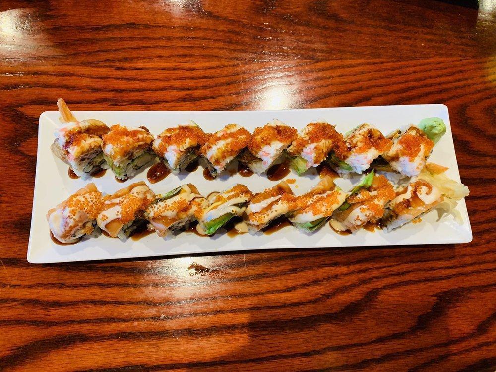 Dragon Roll · Shrimp tempura and cucumber topped with unagi, crab meat, avocado, tobiko and unagi sauce. Cooked.