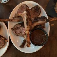 Jerk Lamb Chops Appetizer · Lamb chops, dry rubbed with jerk seasonings, marinated, then finished on a charbroiler grill.