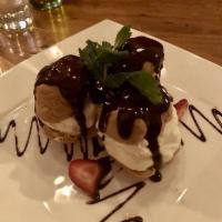 Profiteroles · Gluten free. Rice flour beignets filled with mascarpone-whipped cream and covered with dark ...