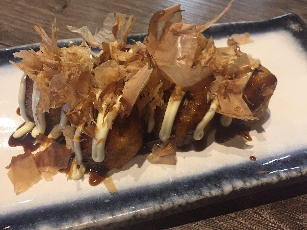 Takoyaki · Deep fried octopus dumpling Japanese mayo ton katsu topping with bonito flakes.