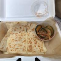 Quesadilla · Your choice of protein, shredded cheese, black bean corn salsa, Yumbii chili sauce and side ...