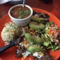 Carne Asada Laguna · Flank steak with melted Monterey Jack cheese and topped with avocado slices.