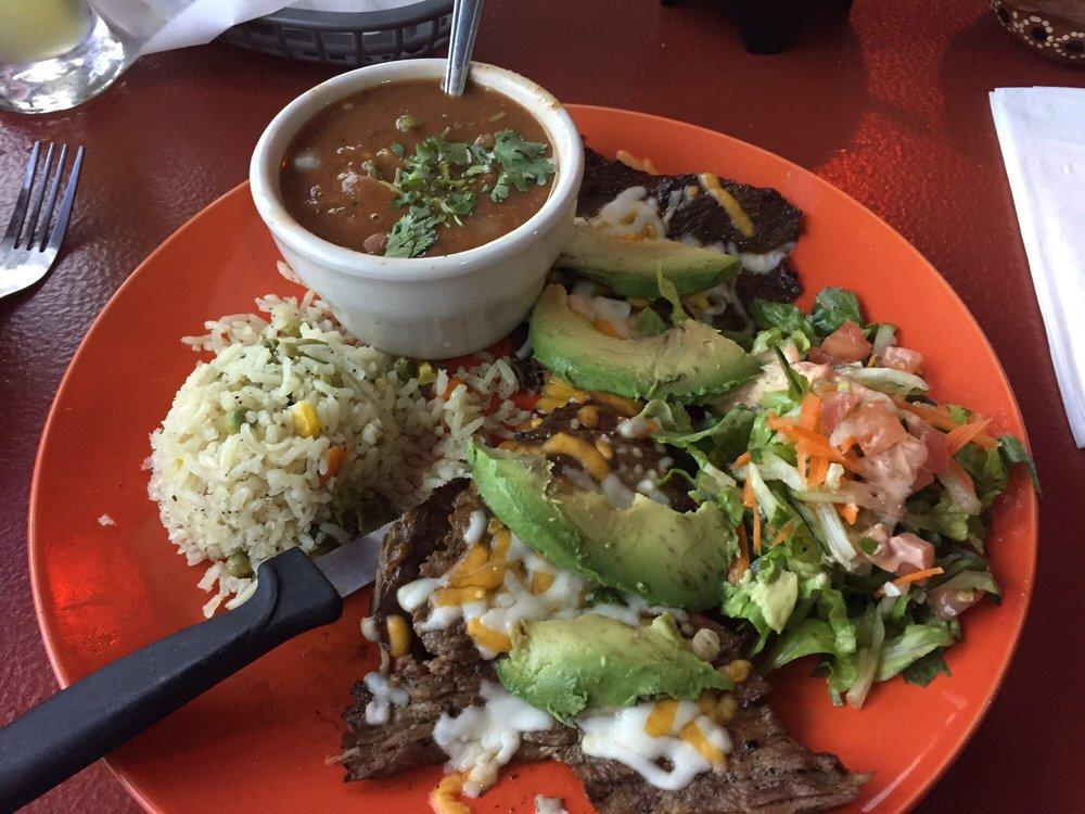 Carne Asada Laguna · Flank steak with melted Monterey Jack cheese and topped with avocado slices.