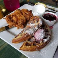 Chicken and Waffles · Buttermilk fried chicken breast with waffle, blackberry butter, blackberry syrup
and powdere...