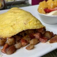 The Meat Lover Omelet · Bacon, sausage, kielbasa, ham, garlic, jack and cheddar cheeses tucked inside 3 eggs. Served...