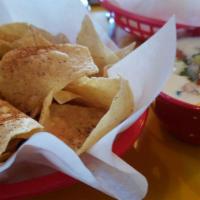 Chips and Queso · Basket of fresh tortilla chips seasoned with Fuzzy Dust, and served with queso.