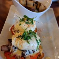 Grove Eggs Benedict · Pork belly, tomatoes, poached egg, English muffins topped with hollandaise, grove potatoes.