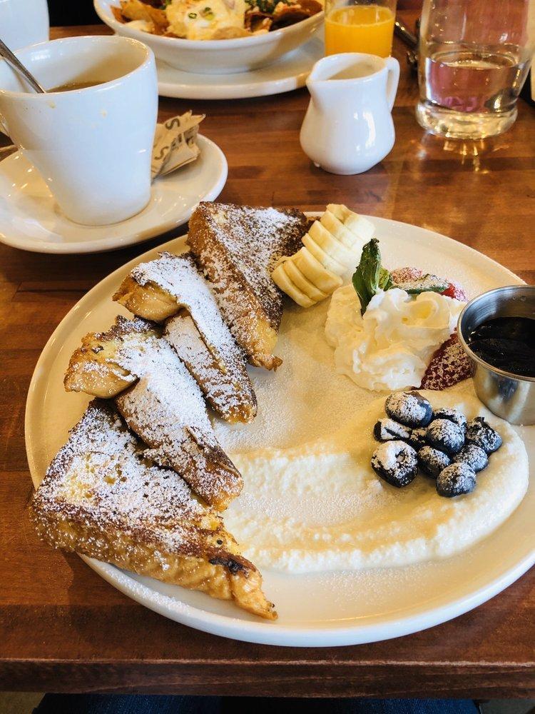 French Toast · House batter, fresh berries, banana, 100% maple syrup, ricotta cheese, mint leaves.