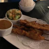 Satay · Chicken or tofu marinated served with cucumber salad and peanut sauce.