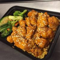 Sesame Chicken Rice Bowl · Served with choice of rice and grilled mixed veggies.