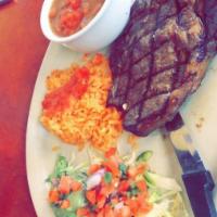 Carne Asada · Marinated grilled rib-eye steak topped with green scallions. Served with rice, pico de gallo...