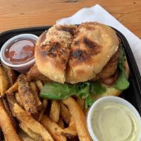 Grouper Deluxe Fish Sandwich · Grouper filet, spring mix, tomatoes and green onion tartar sauce on a coconut bun.