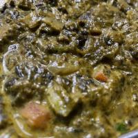 Saag Paneer · Fresh spinach cooked with herbs, and homemade cheese.
