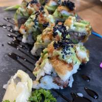 Surf and Turf Roll · Grilled kobe beef and asparagus inside topped with shrimp tempura, tobiko and scallions.