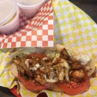 Chicken Cheesesteak Sandwich · Our spicy grilled chicken chopped with grilled onions and topped with melted white American ...