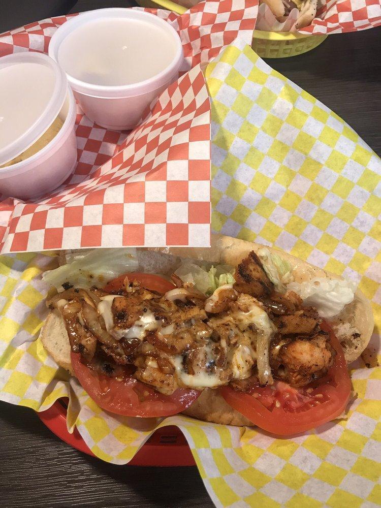 Chicken Cheesesteak Sandwich · Our spicy grilled chicken chopped with grilled onions and topped with melted white American cheese, on a hoagie roll. Add ons for an additional charge.