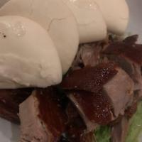 Peking Duck · Roasted duck, served with fresh spring onions, cucumbers hoisin sauce and lotus buns.
