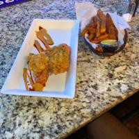 Fried or Grilled Lobster Tails · Seasoned Battered and Fried or Grilled to Perfection with garlic butter sauce, served with y...