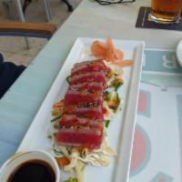 Ahi Tuna · Seared with sesame seeds, served on a bed of Asian inspired coleslaw, tossed with ponzu and ...