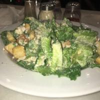Chicken Caesar Salad · Romaine lettuce, parmesan, chicken, croutons, caesar dressing. Side of garlic bread included.