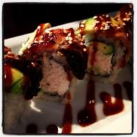 Dragon Roll · California roll topped with broiled eel, avocado, sweet sauce, and sesame seed.