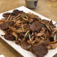 Beef Chow Fun · Stir fried vegetables and noodles with beef.