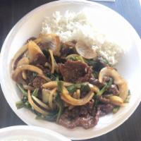 Mongolian Beef · Sauteed white onions, green onions, and minced ginger in a rich garlic sauce.