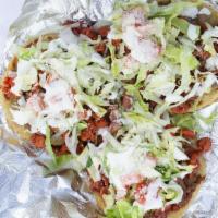Sope · With your choice of meat, beans, cheese, lettuce, tomatoes.