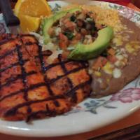 Pollo Asado · Grilled boneless, skinless Chicken breast marinated in citrus juices and spices. Includes sp...