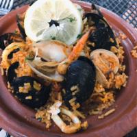 Seafood Paella · Our Seafood paella, Byrsa Bistro style, calamari, clams, mussels, white fish, shrimp, olives...