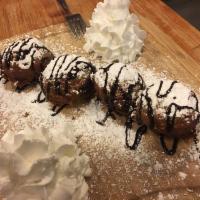 Deep Fried Oreos · 4 Oreo cookies battered and deep fried with powdered sugar and Ghirardelli chocolate