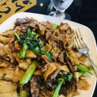 Pad See Ew · A choice of meat stir-fried with flat rice noodles, egg and Chinese broccoli in a sweet soy ...