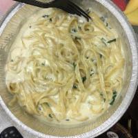 Fettuccine Alfredo · Served with garlic knots.