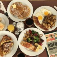 The Monte Carlo Breakfast · 2 pieces of Texas French toast stuffed with bacon, scrambled eggs and cheese with homefries ...