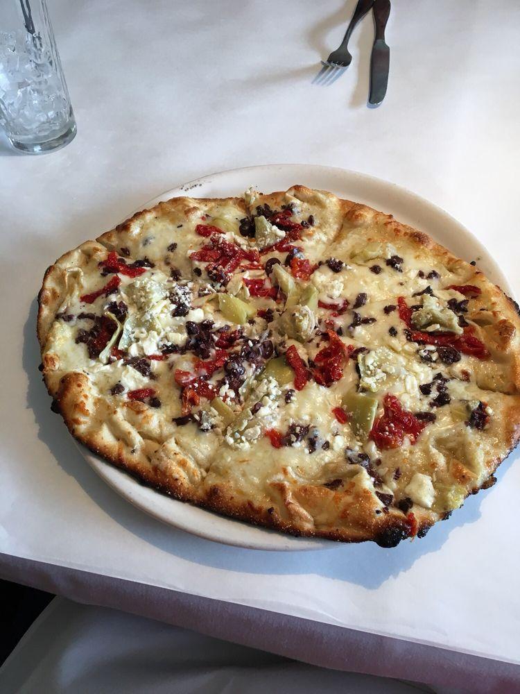 Mediterranean Pizza · Feta, Kalamata olives, sun-dried tomatoes, artichokes and mozzarella.