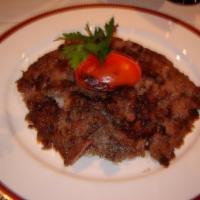 Doner Kebab · Vertically grilled lamb sliced very thin, served over white rice.
